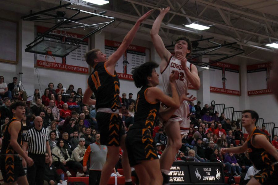 Cowboys Lasso the Tigers in Basketball Playoff Game