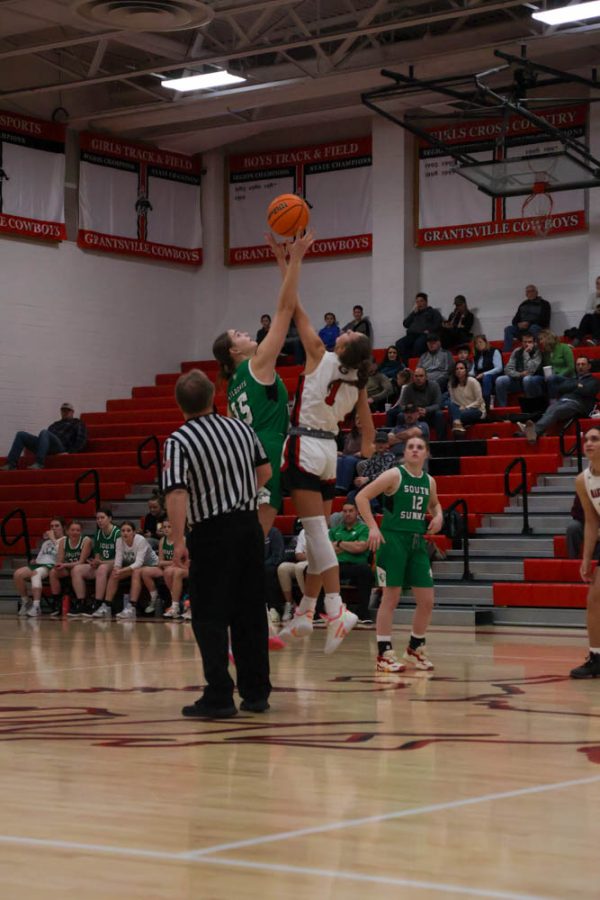 Baylee Lowder jumping for tip off during Grantsvilles girls basketball game vs South summit.