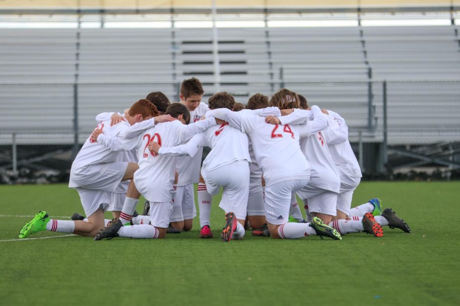Soccer team praying before game vs Ogden