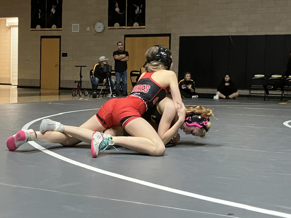 Zivah Sires from Grantsville working for a pin against Union’s Kabree Duncan in the 100 pound weight class 
