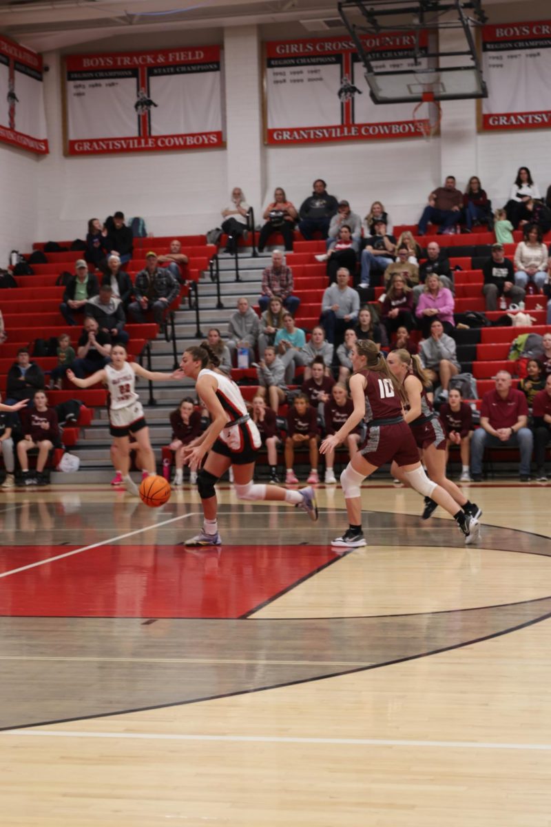 1/30/24 Girls Grantsville Basketball vs. our Rivals Morgan. Baylee Lowder making her way to the hoop at GHS.