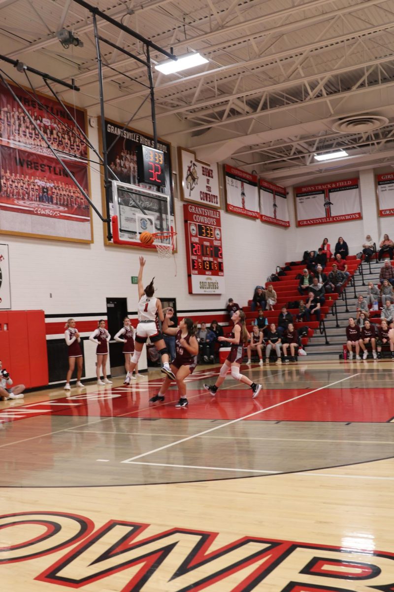 1/30/24 Girls Grantsville Basketball vs. our Rivals Morgan. Baylee Lowder shooting the ball to the hoop. at GHS 