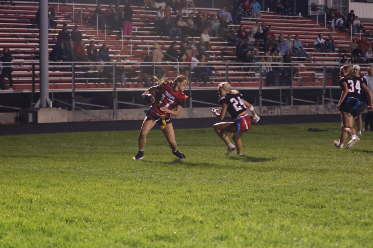 Avery Allred running the ball against Allie Wilkins 