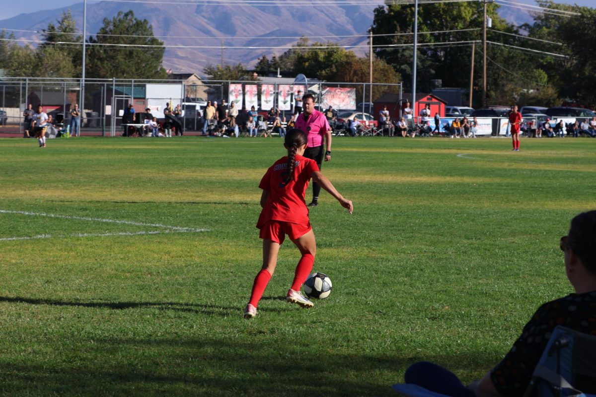 Kamry Allen kicking ball to teammate against Union playoff game