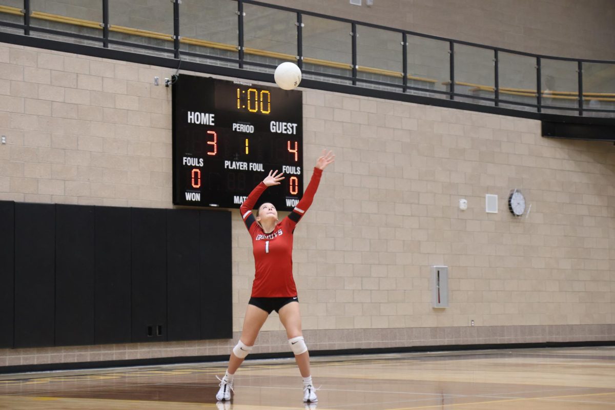 Haizlee Hall serving in sophomore game against Union 