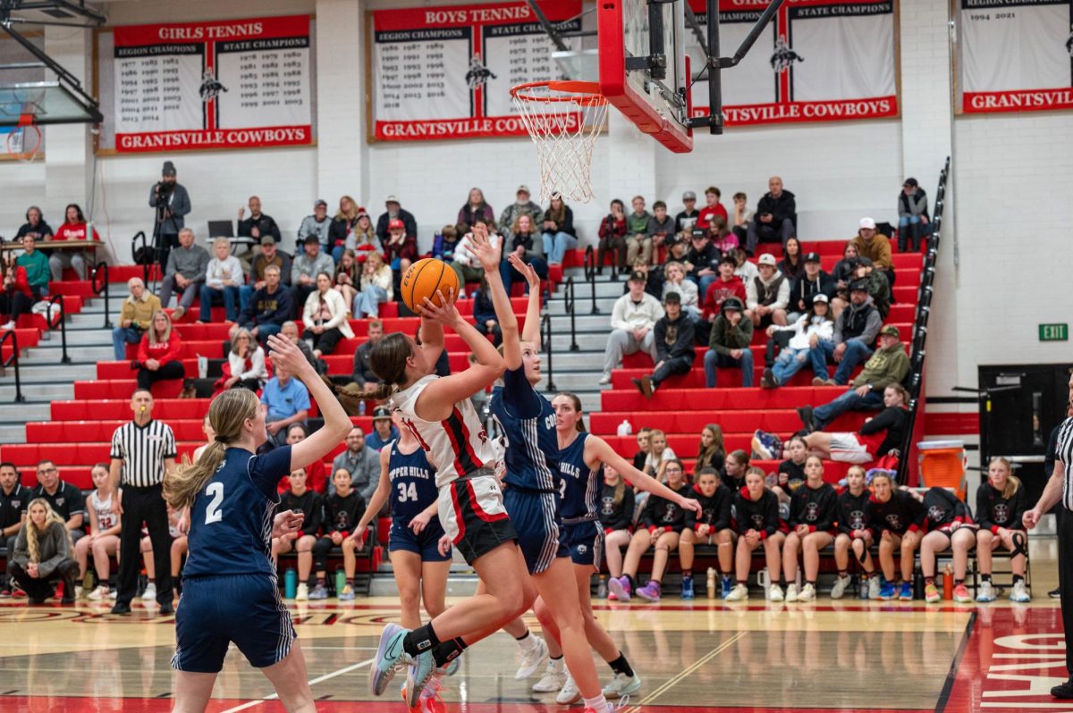 Avery Allred shooting layup against copper hills