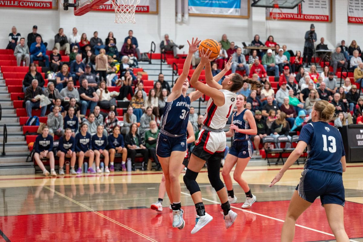 Bailey Lowder shooting layup against copper hills 