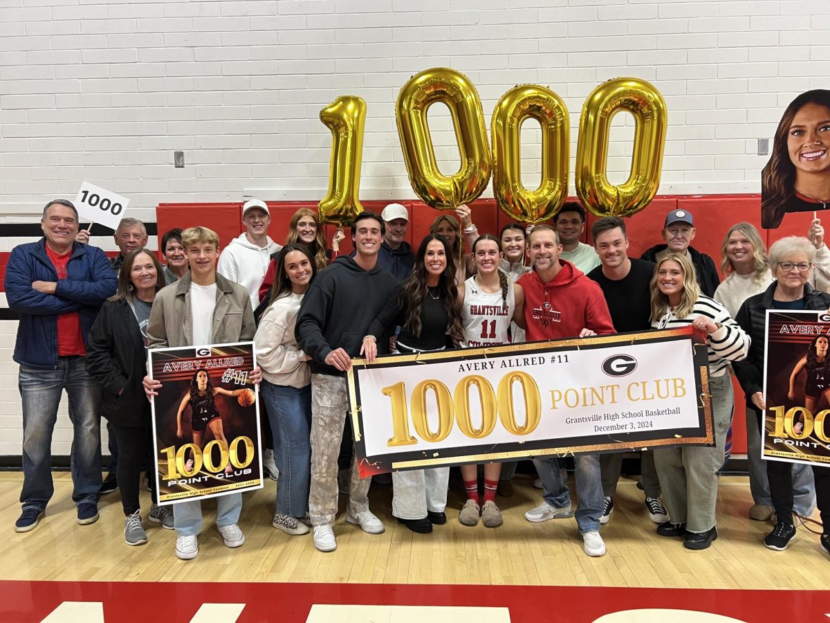 Avery Allred and her family after 1000 point career game