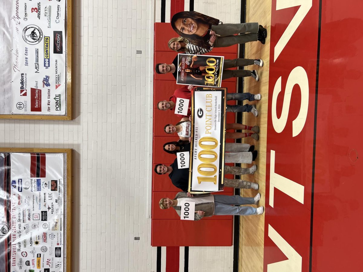 Avery Allred and her family after 1000 point career game