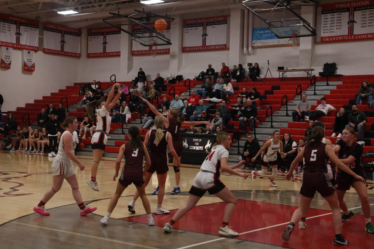 Nia Jones shooting a 3 pointer against Morgan in JV